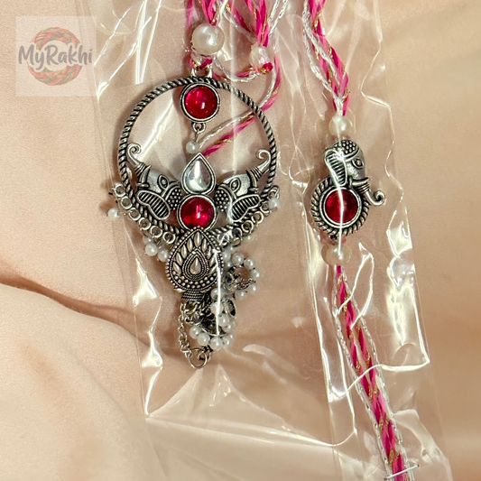 A beautiful and minimalist rakhi that focuses on the elegance of simplicity and the purity of the sacred thread.